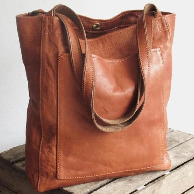 Heritage leather tote in tan brown, front view with slip pockets