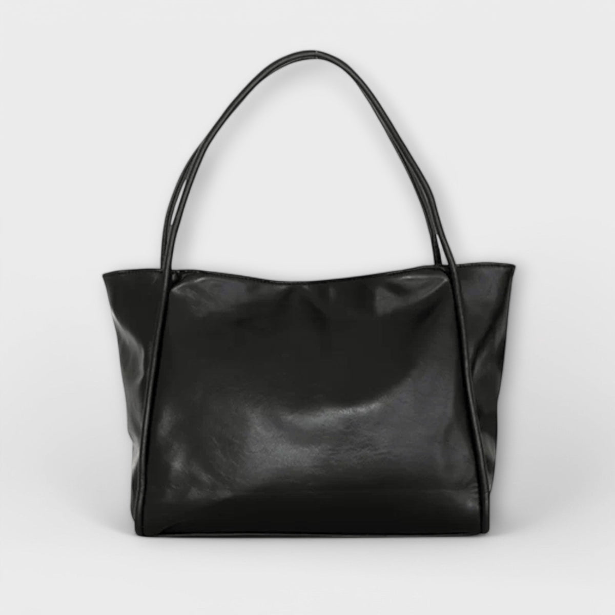 Valerie Blair tote bag in black, front view with double handles