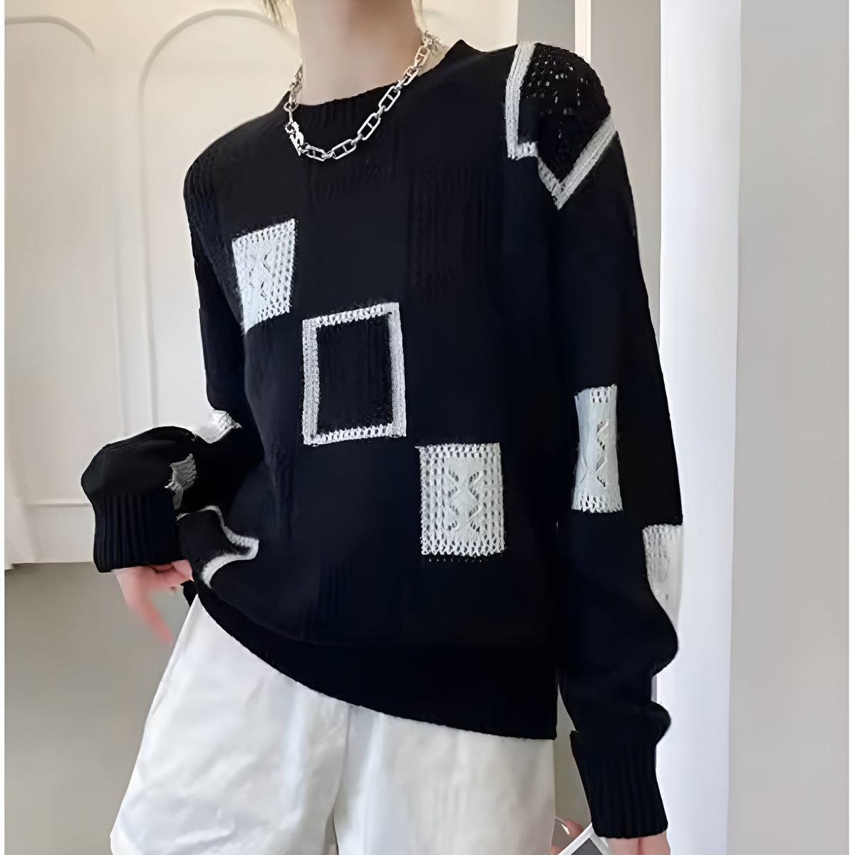 Zaydeanne patchwork sweater in black with white squares, front view
