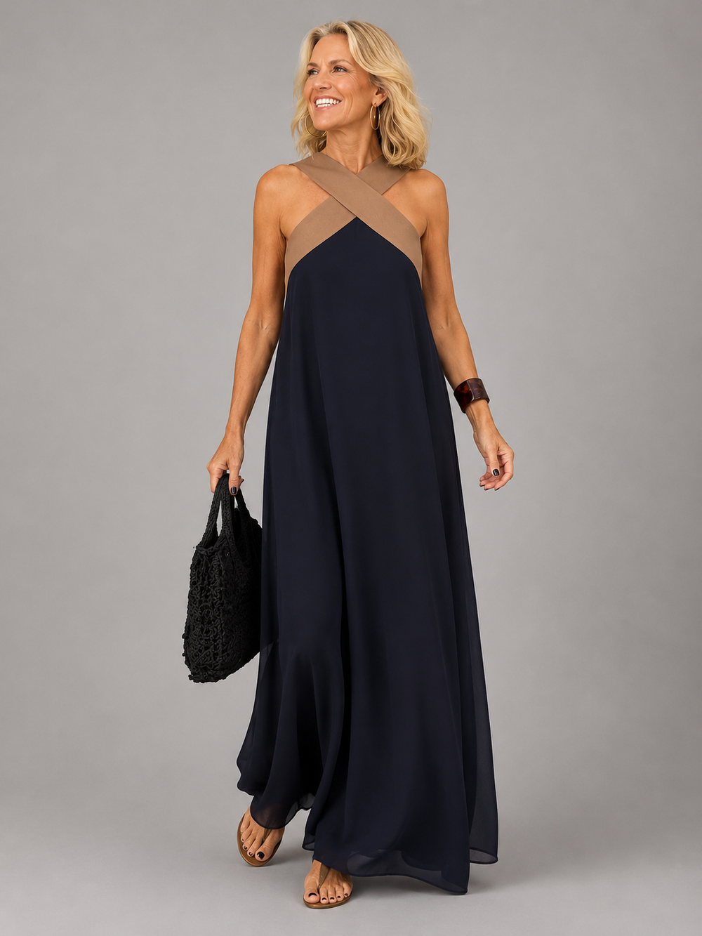 Edie halter maxi dress in navy with contrast crossover neckline, full-length front view