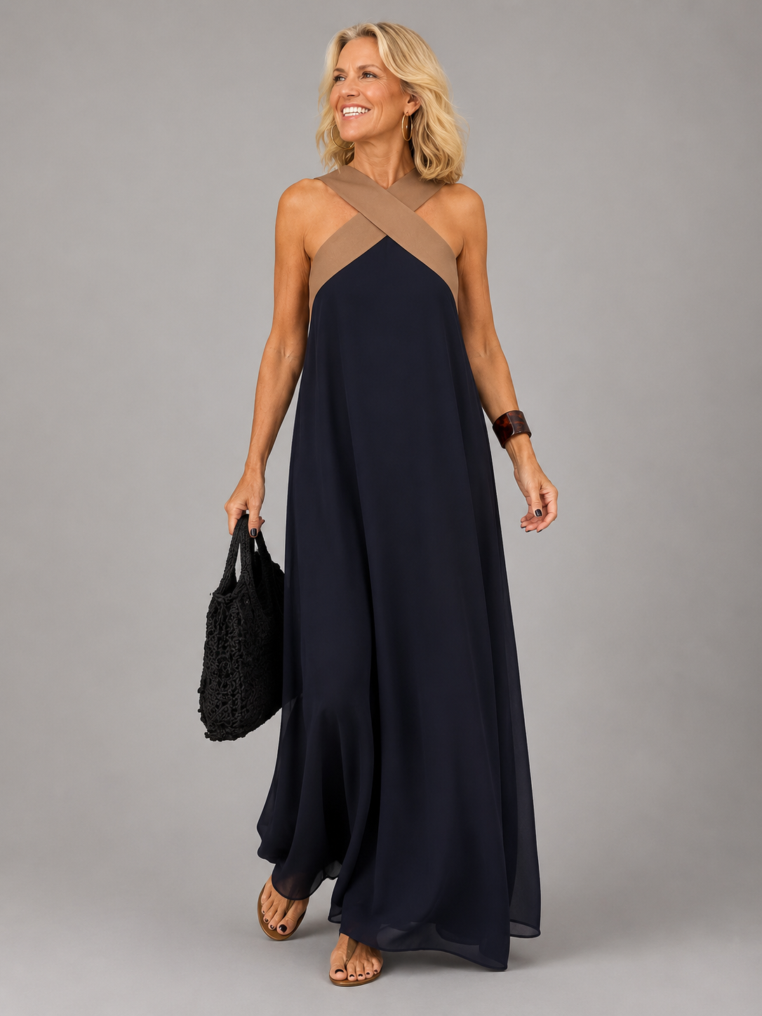 Edie halter maxi dress in navy with contrast crossover neckline, full-length front view