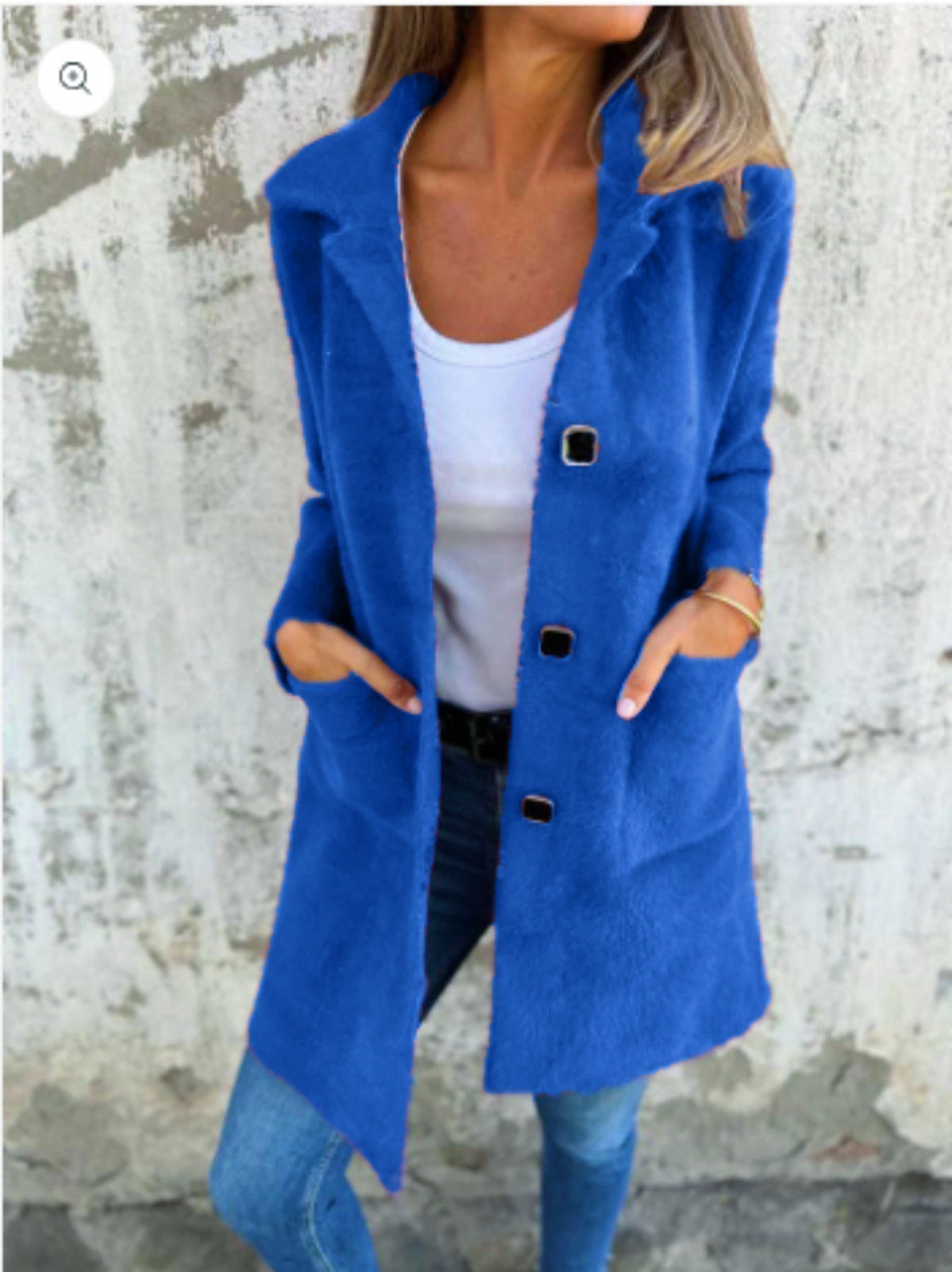 Morwenna long button coat in blue, worn open over a white top
