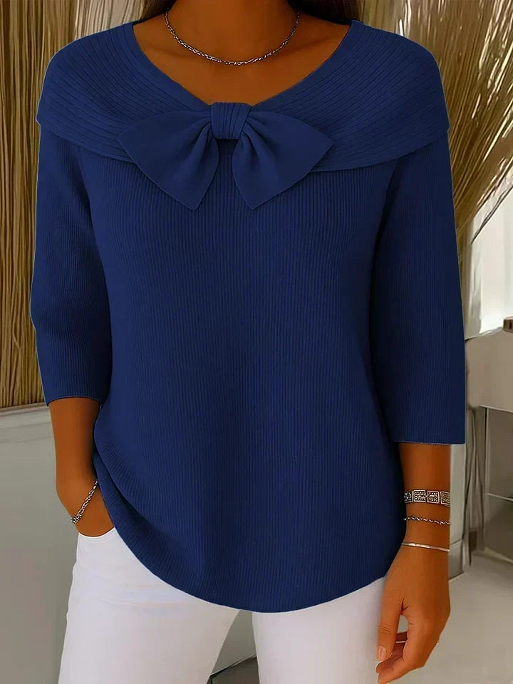 Trinidad bow-detail jumper in dark blue, front view on model