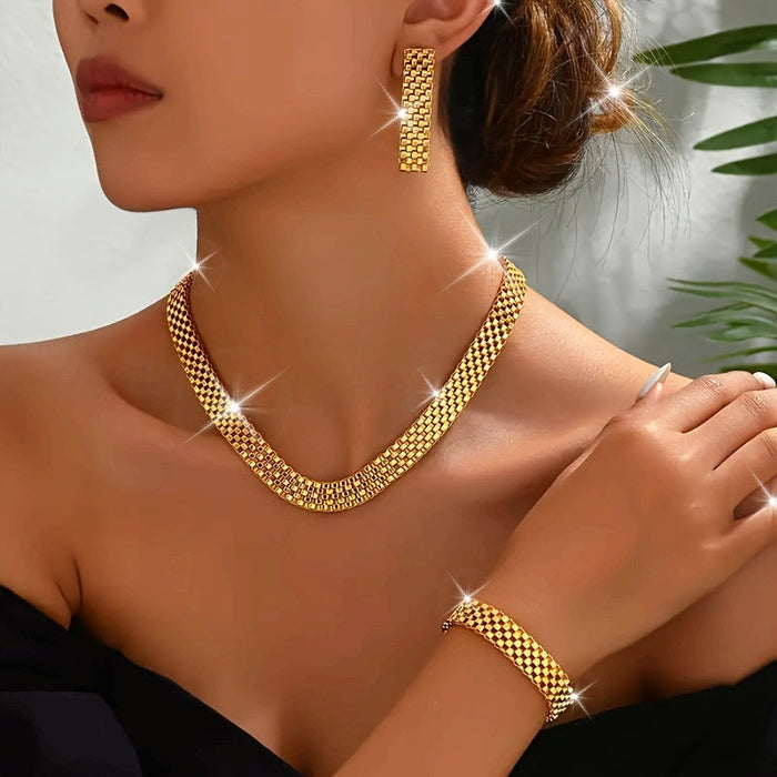 Woven gold necklace, bracelet and earrings set worn by a model