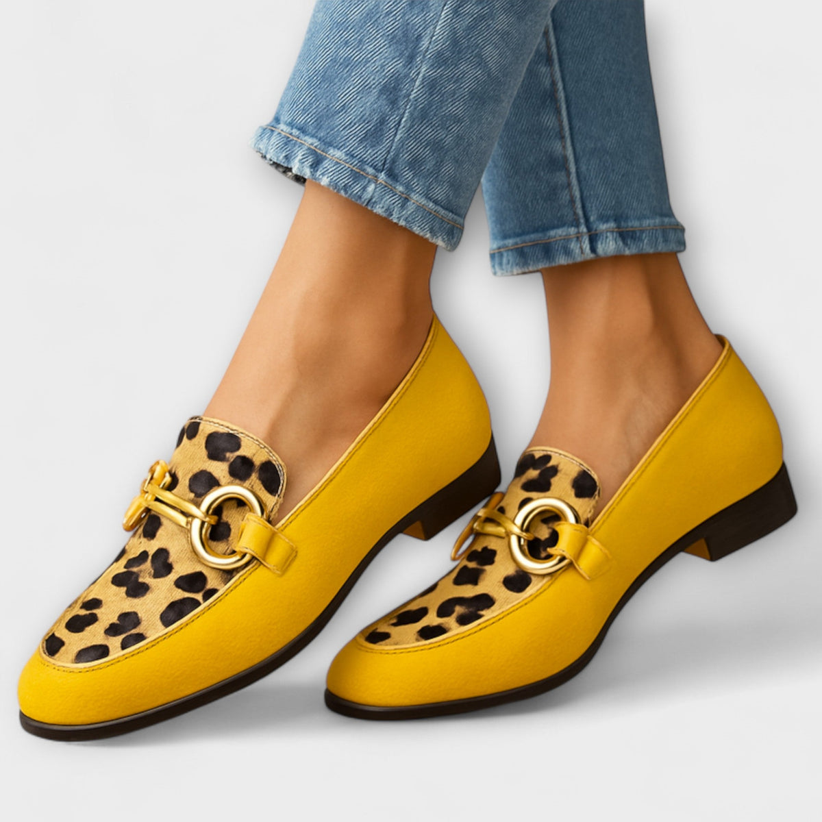 Daphne loafers in yellow with leopard print panel and gold buckle, worn with cropped jeans