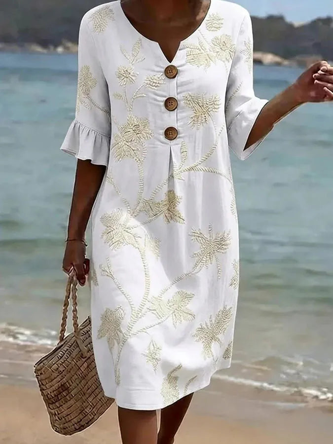 White floral print casual dress, full-length front view on the beach