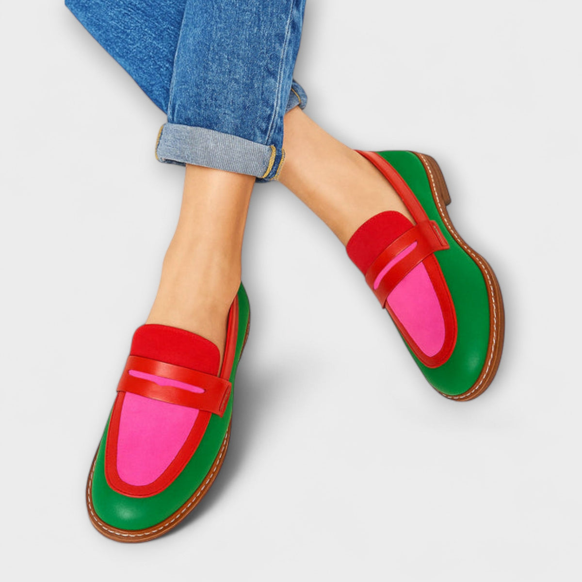 Claudia loafers in green, red and pink, worn with turned-up jeans