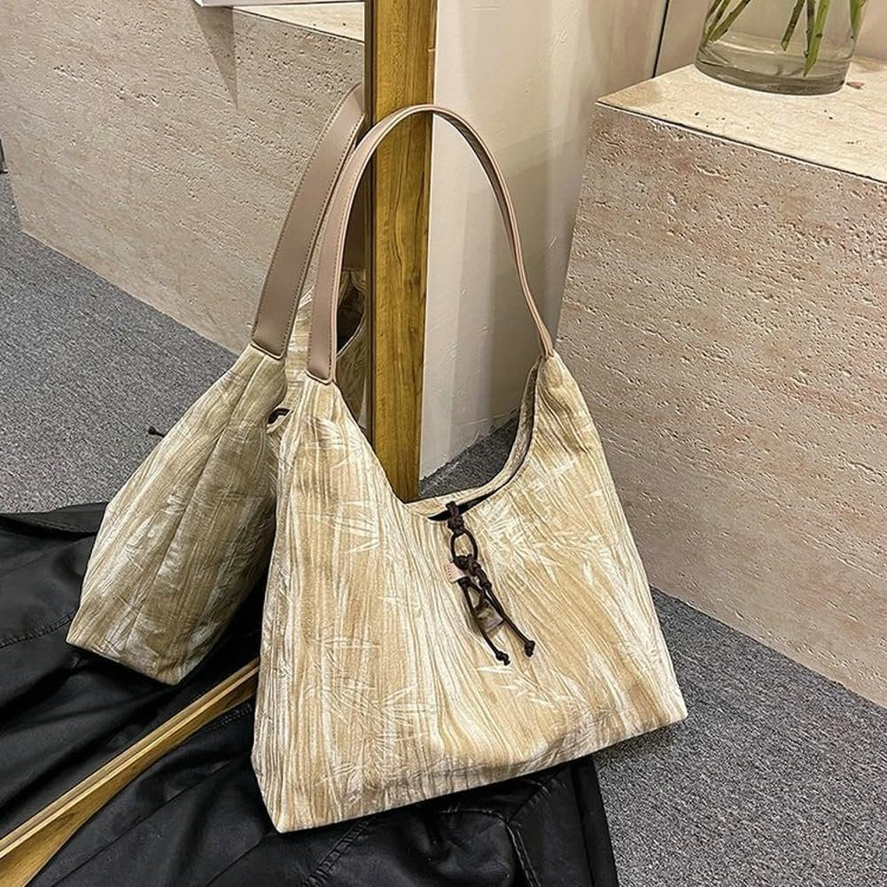 Amélie shoulder bag in beige standing upright, side angle
