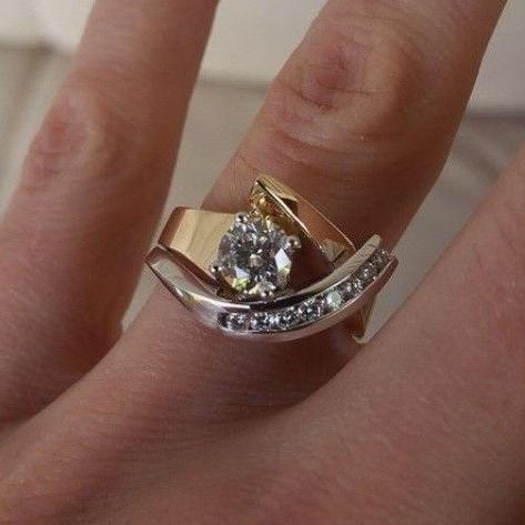Karla two-tone zirconia ring worn on the finger, close-up angled view