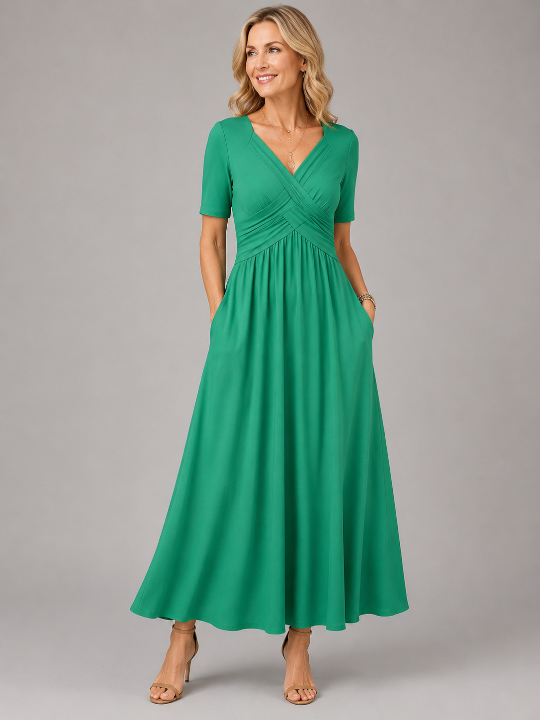 Angela crossover V-neck dress in green, full-length front view