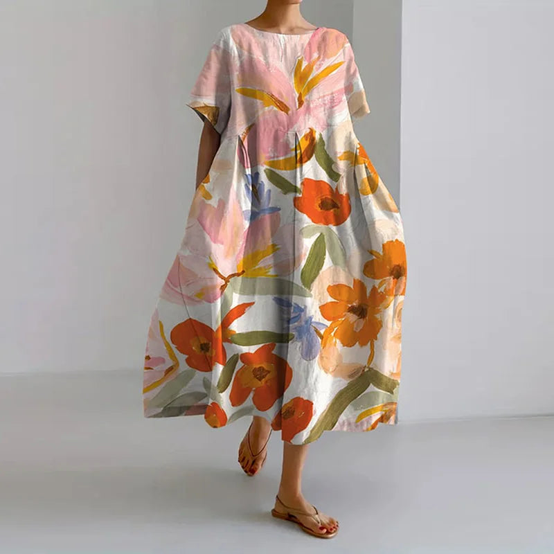 Primrose floral summer dress in pink and orange, full-length front view