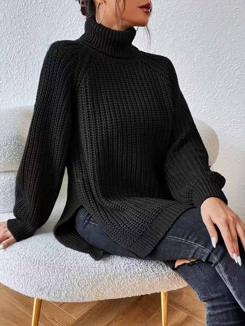 Rylani oversized turtleneck sweater in black, seated front view
