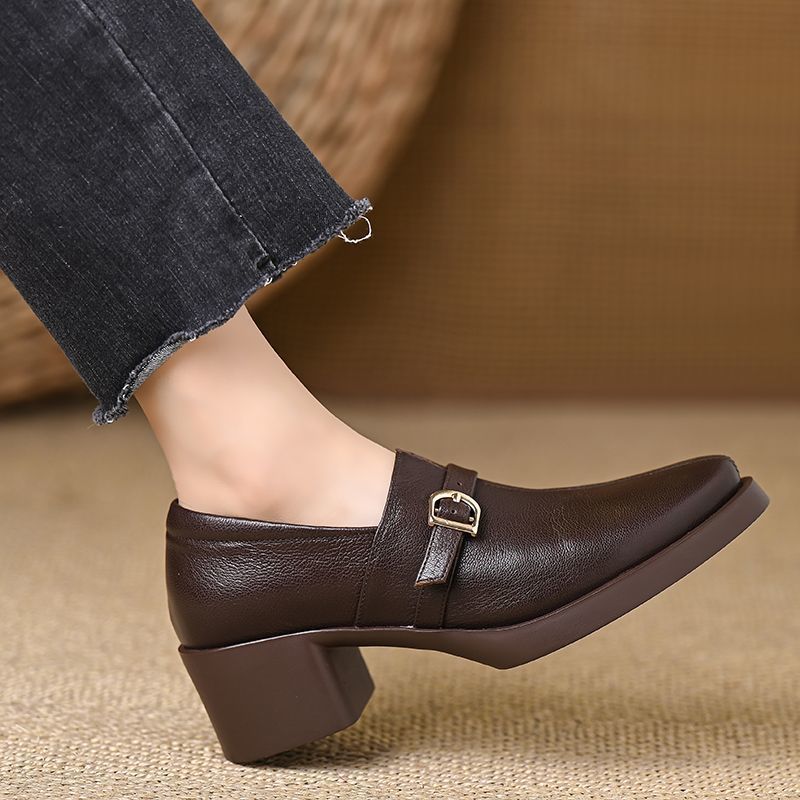 Celine block heels in brown, heel and strap detail worn view