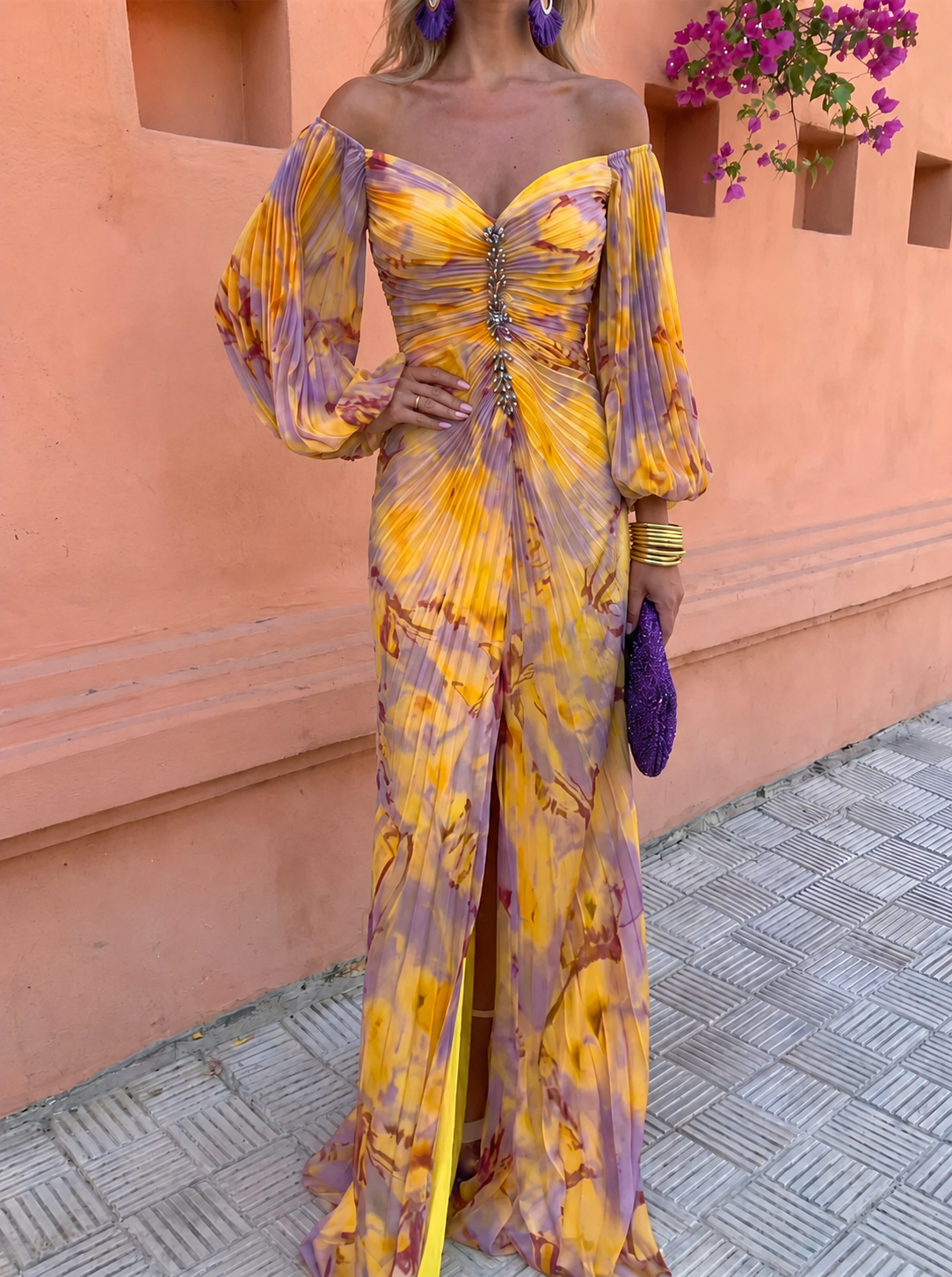 Greta dress in yellow, close view of jewelled deep neckline and pleated bodice