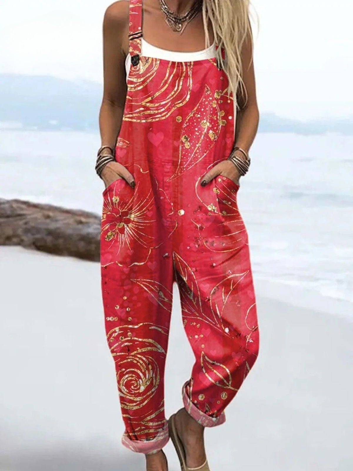 Wildflower Drift dungarees in coral red with golden floral print, full-length front view