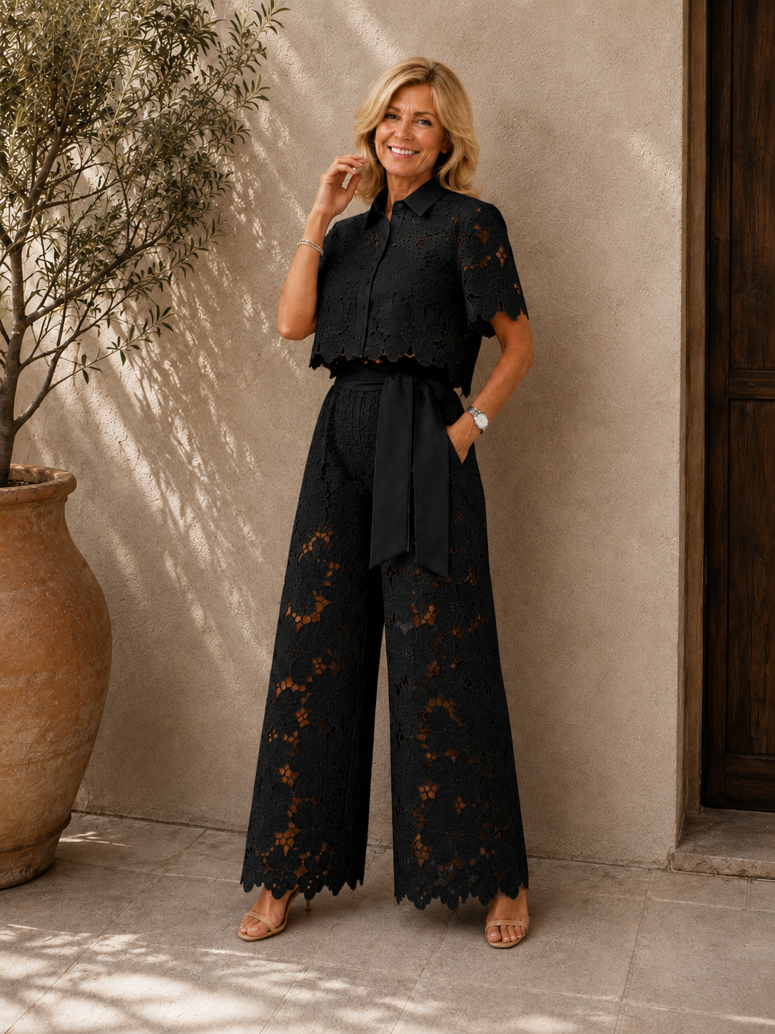Isabela two-piece lace set in black, worn outdoors