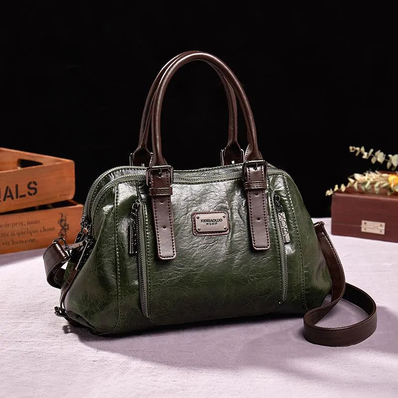 Eveline chic handbag in green, front view with shoulder strap