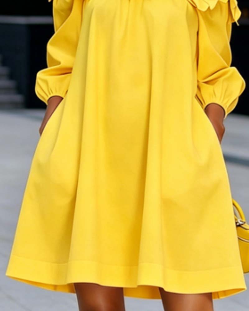 Rowena yellow A-line dress, close-up of flowing skirt
