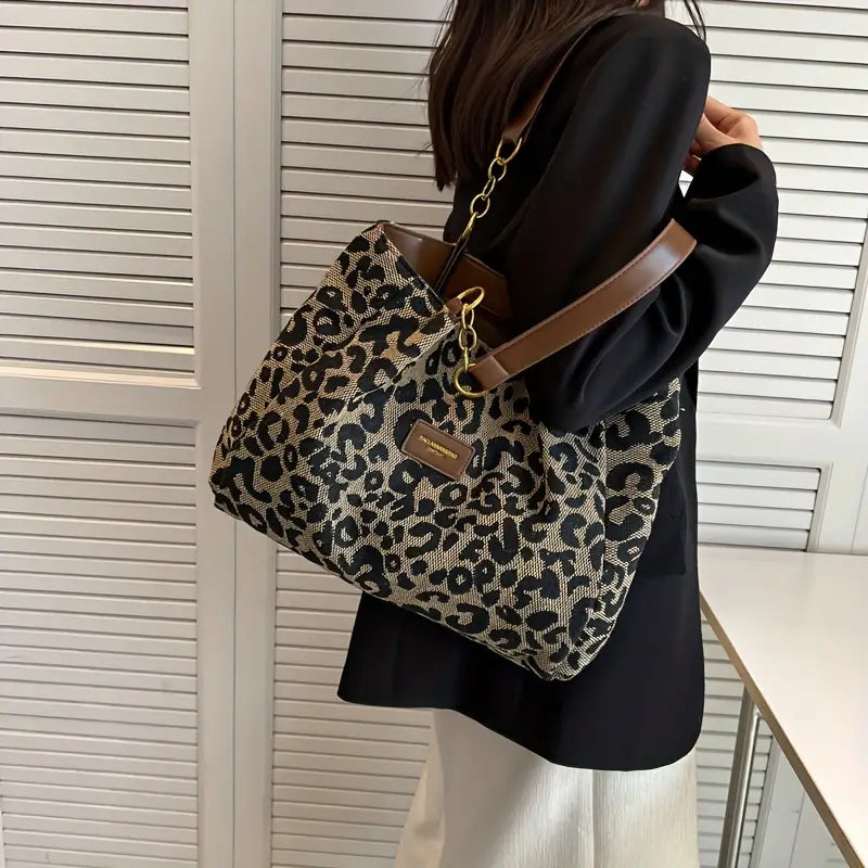 Classic leopard woven tote bag carried on the shoulder with black coat