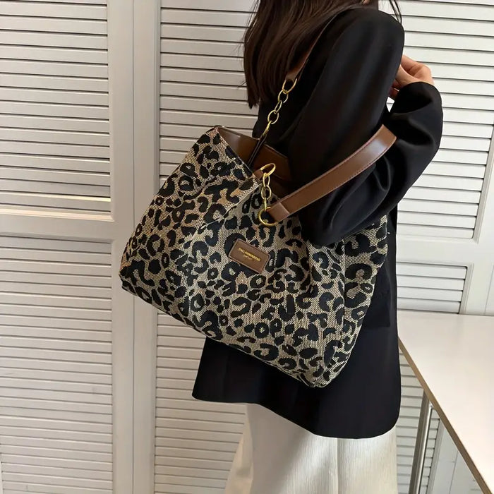 Classic leopard woven tote bag carried on the shoulder with black coat