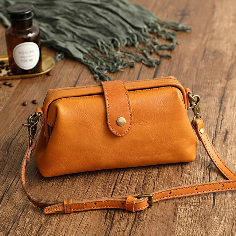 Cressida mini crossbody bag in brown, side angle view