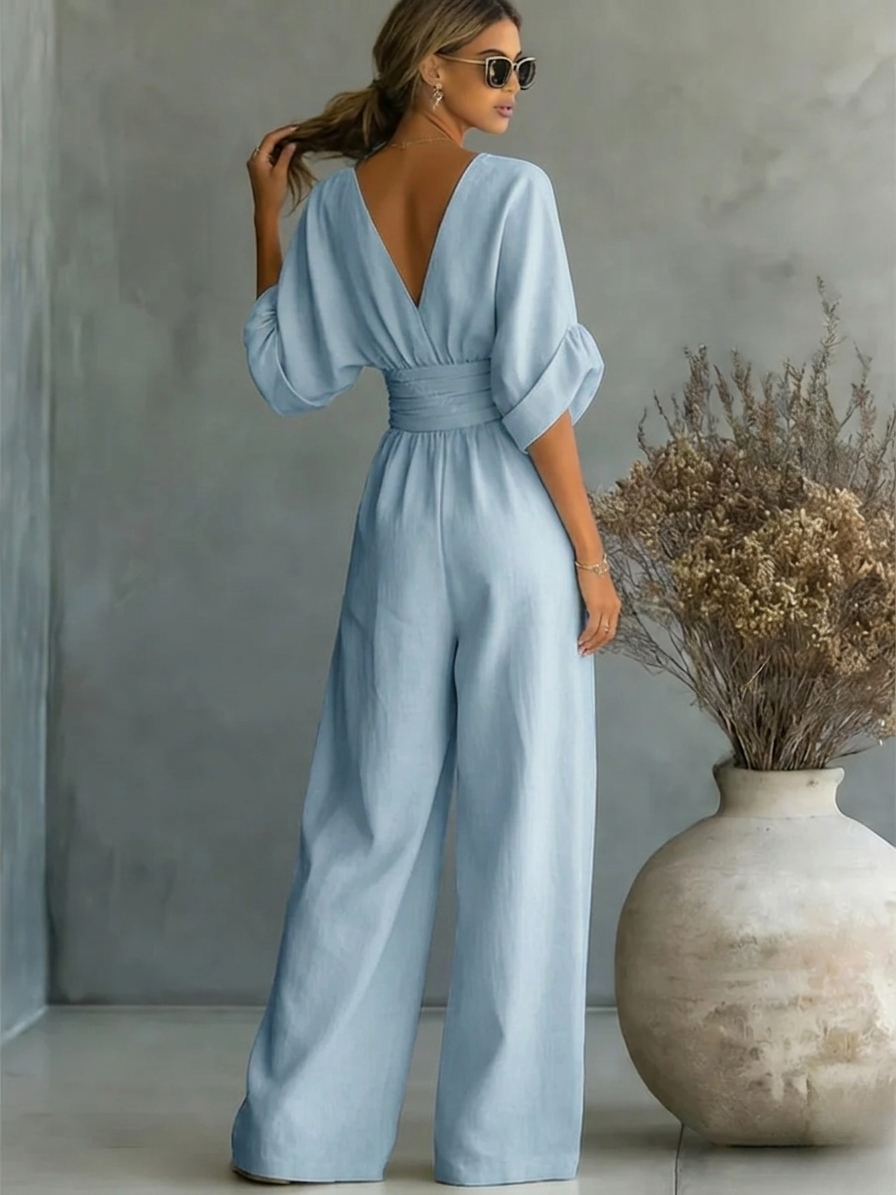 Sofia jumpsuit in powder blue, back view with ruched waistband