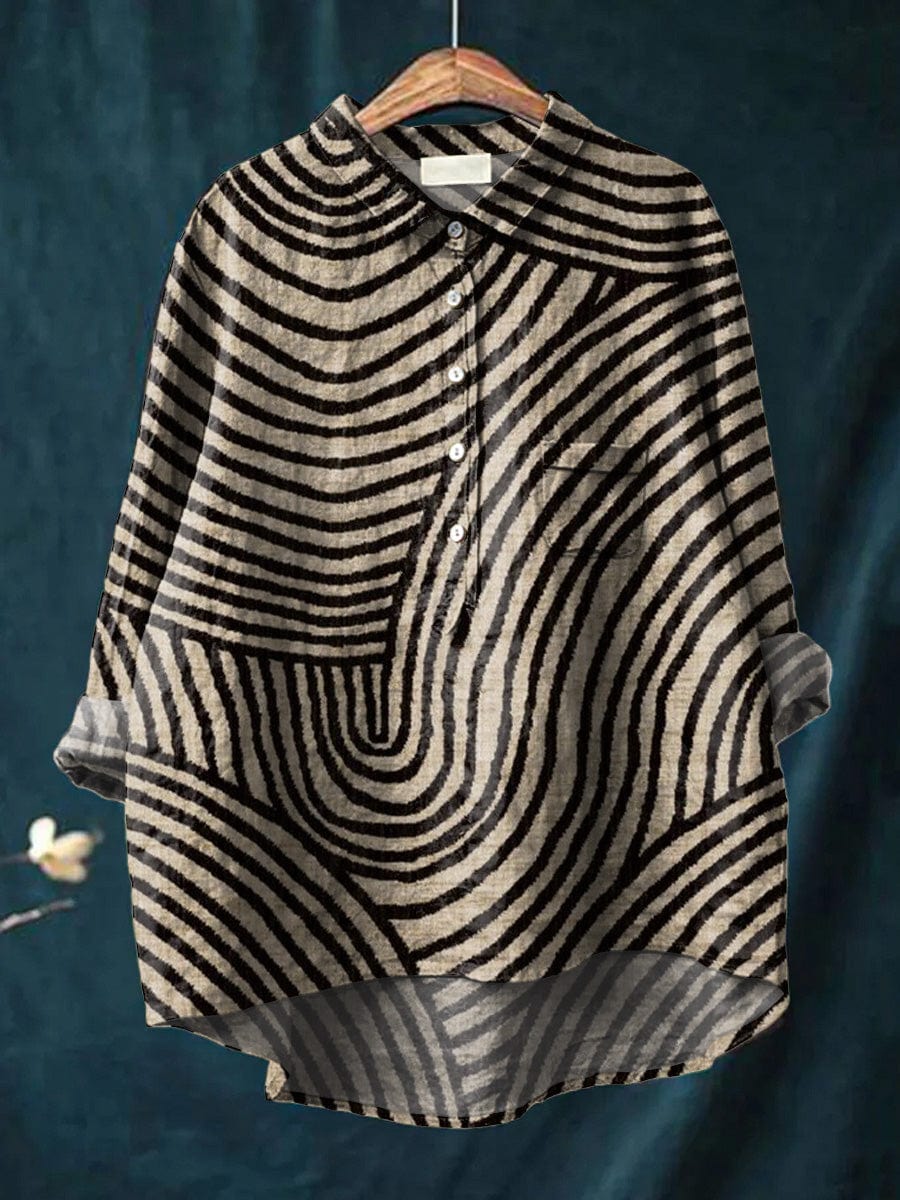 Sabira blouse in black and cream stripes, front view on hanger