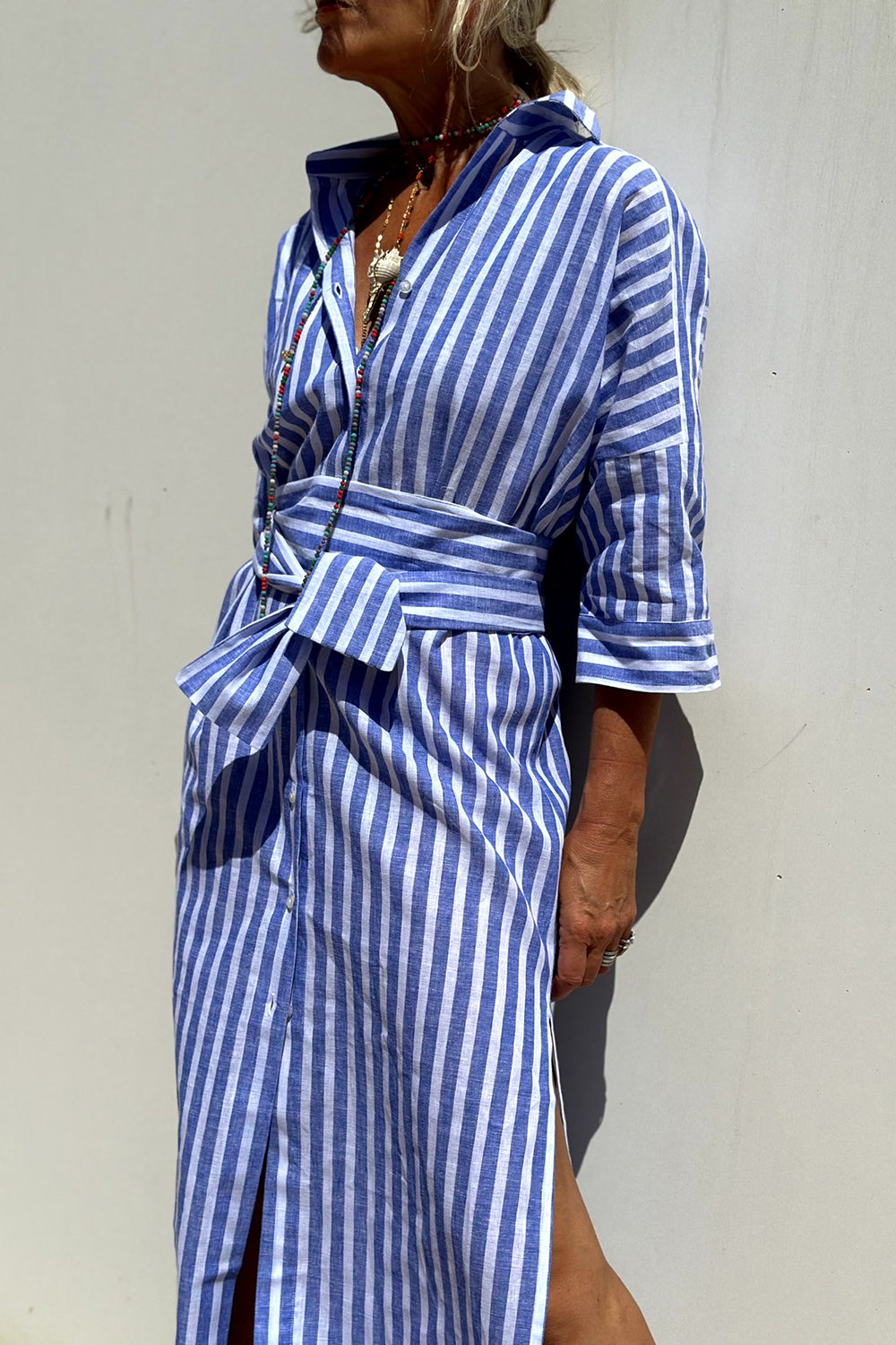 Sophia striped shirt dress in blue, side view with tied waist