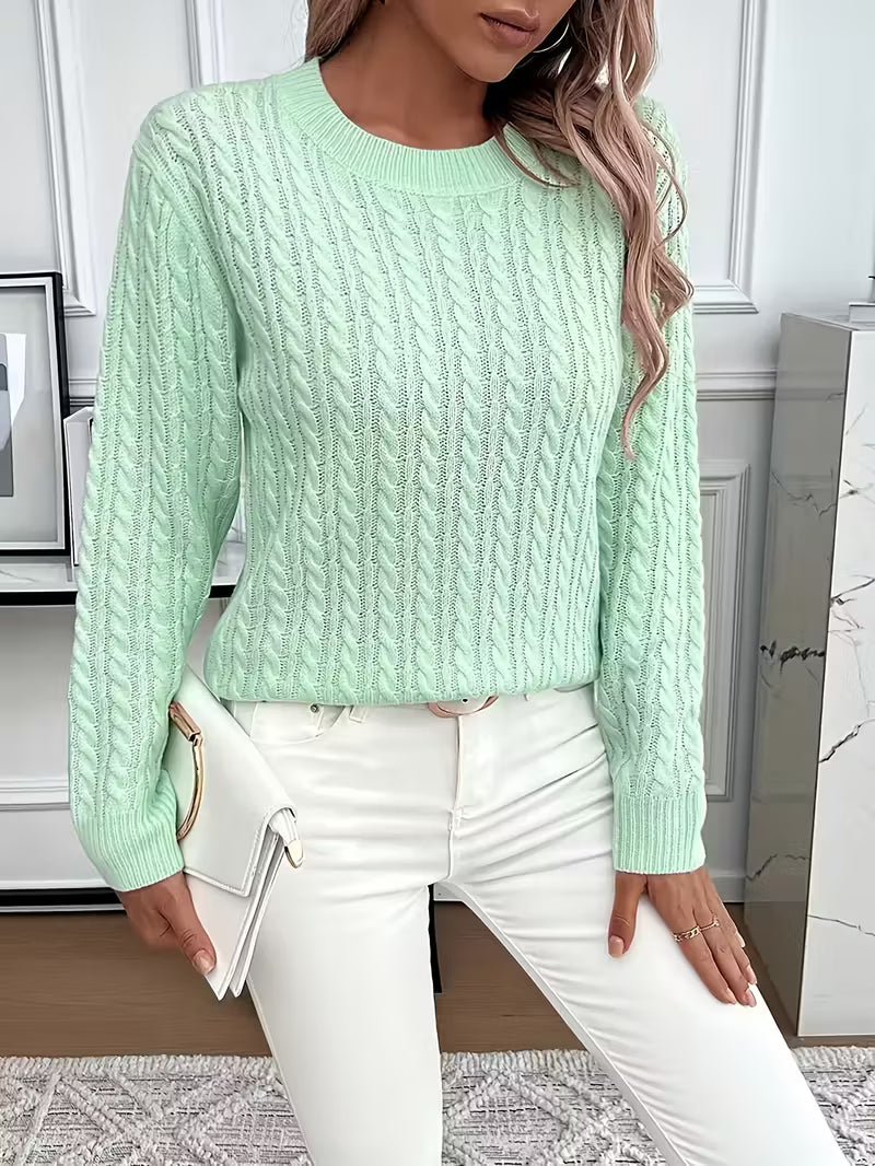 Tahlia soft knit sweater in mint green, styled with clutch bag