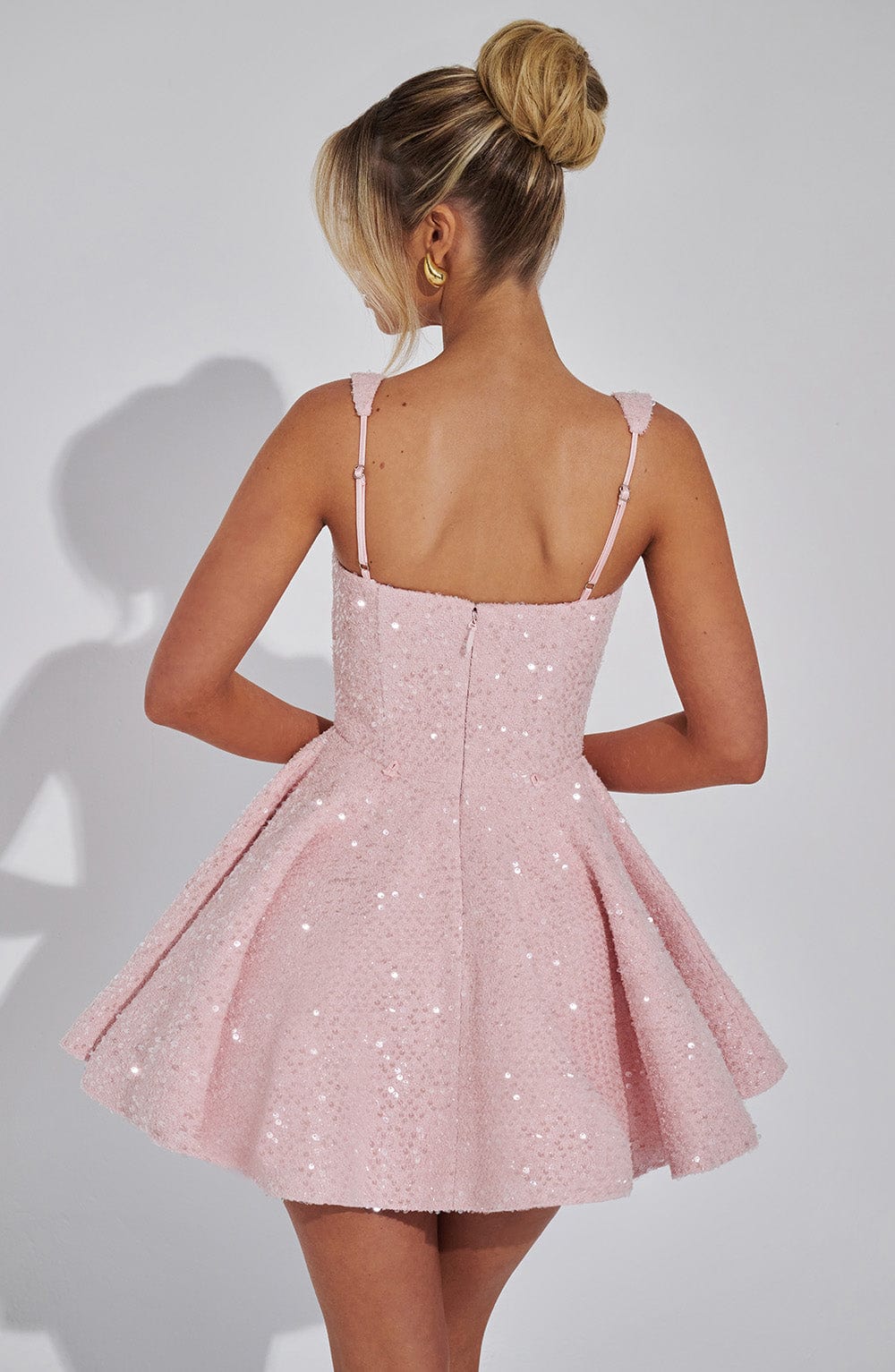 Romy sequin mini dress in pink, back view with zip
