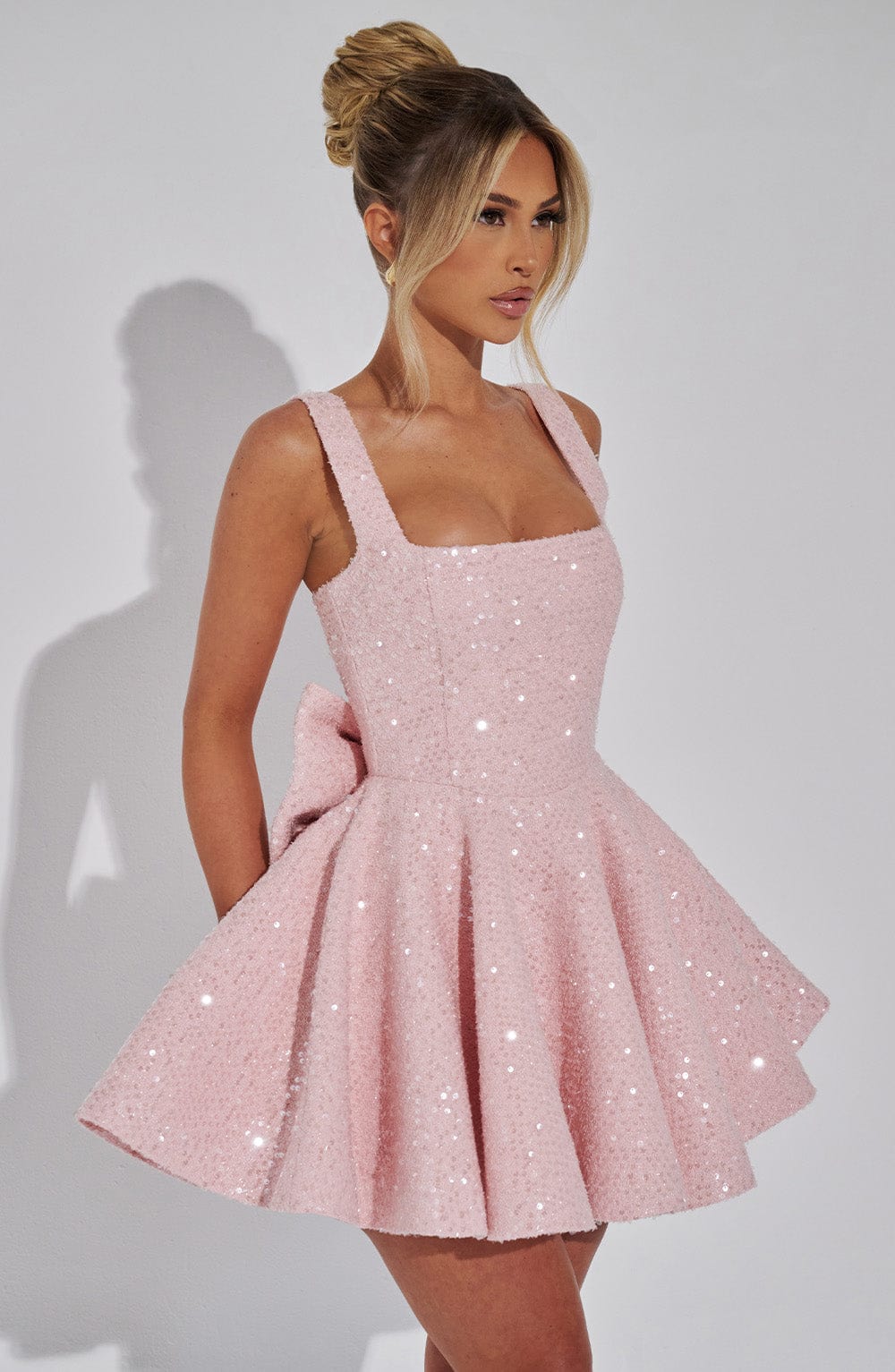 Romy sequin bow dress in pink, three-quarter side view