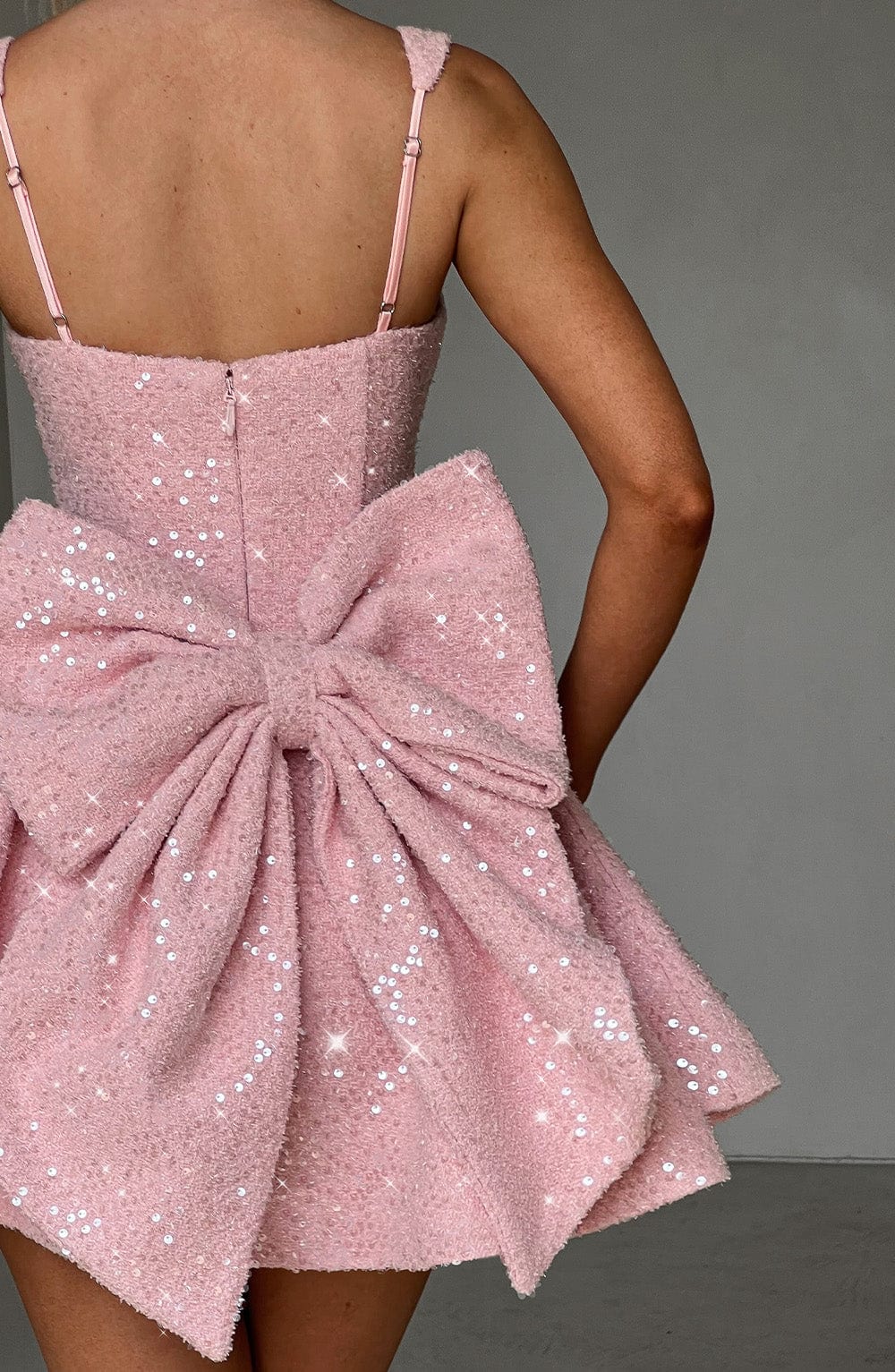 Romy pink sequin dress, close-up of oversized back bow