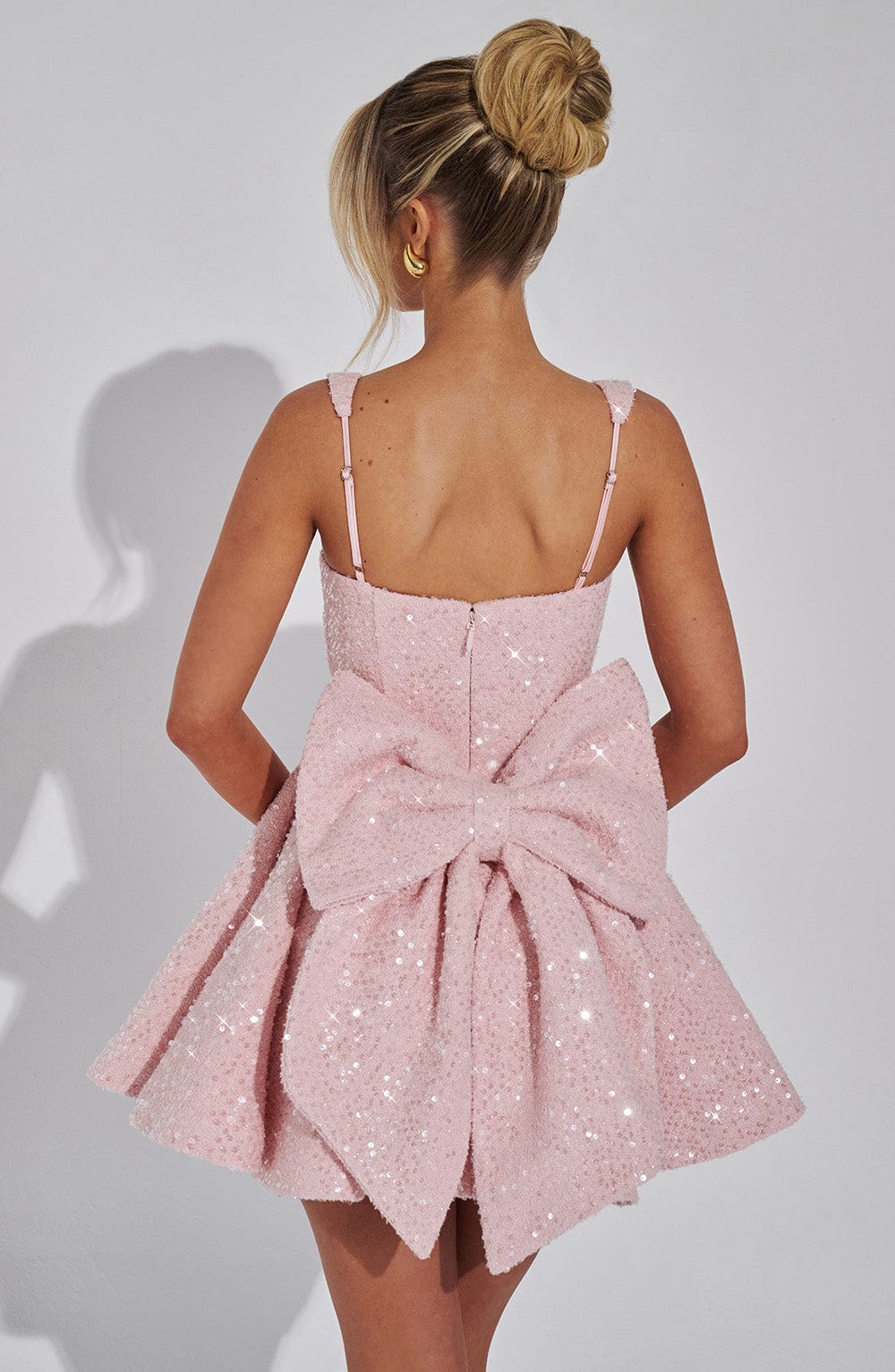Romy sequin dress in pink, back view showing oversized bow