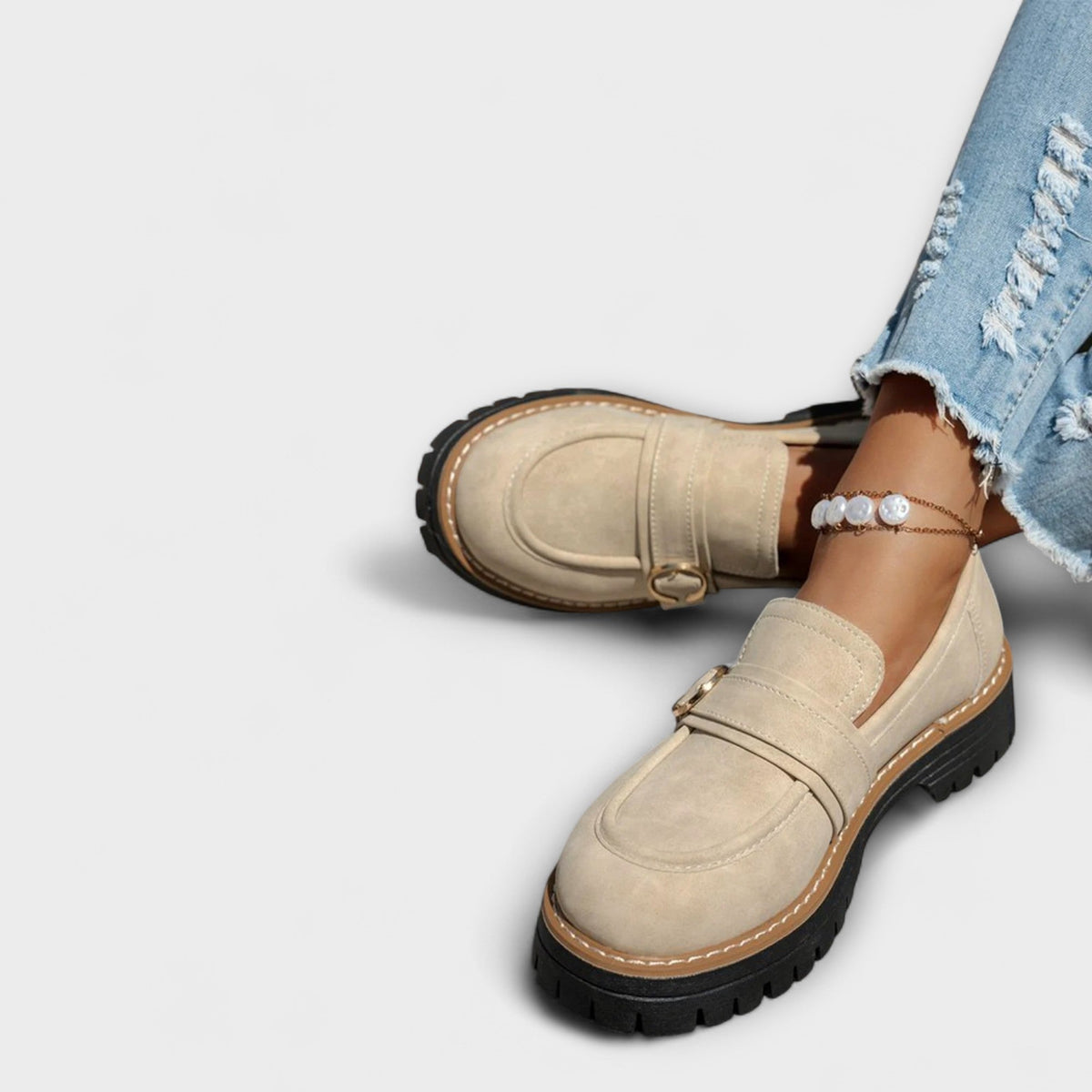 Aurora casual loafers in beige worn with jeans, side view