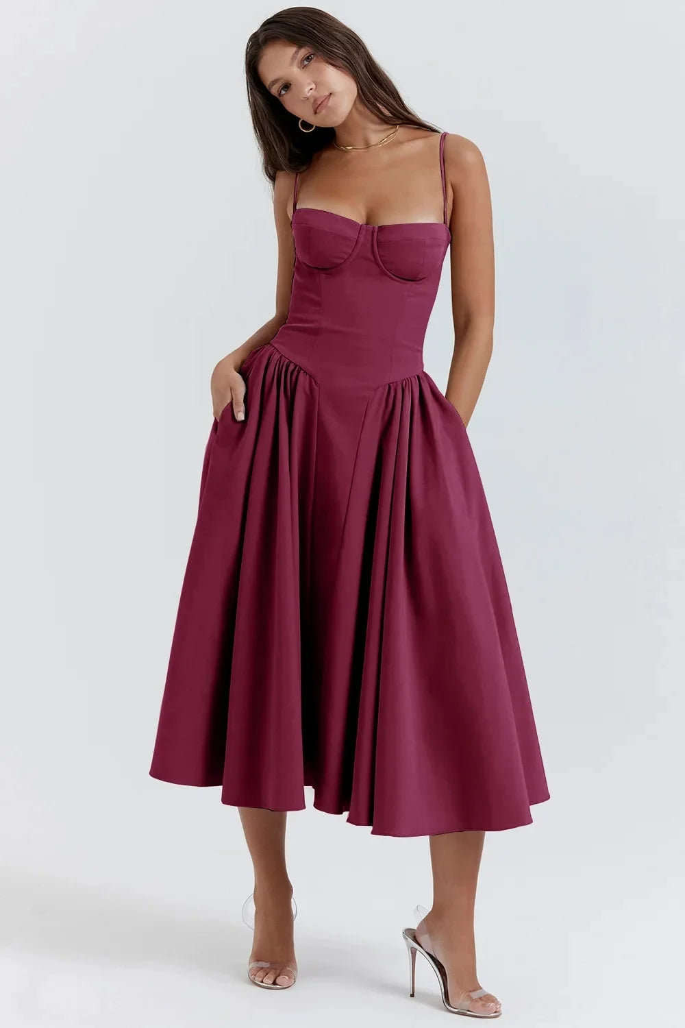 Charmone evening midi dress in burgundy, full-length front view with hand in pocket