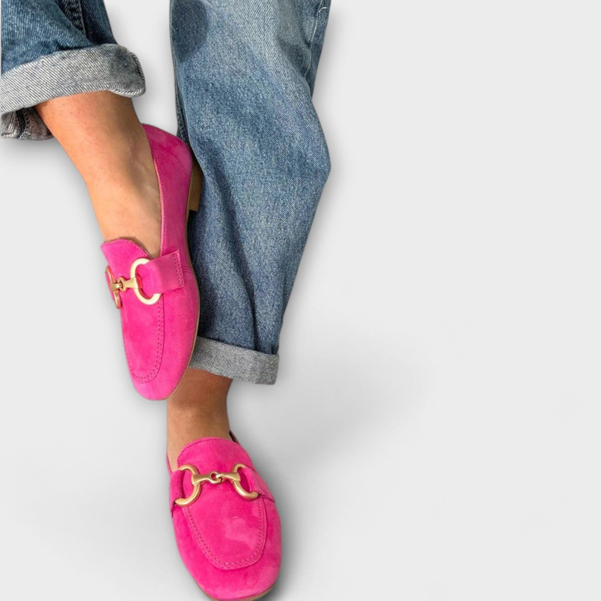 Nora relaxed everyday loafers in pink with gold buckle, worn with turned-up jeans