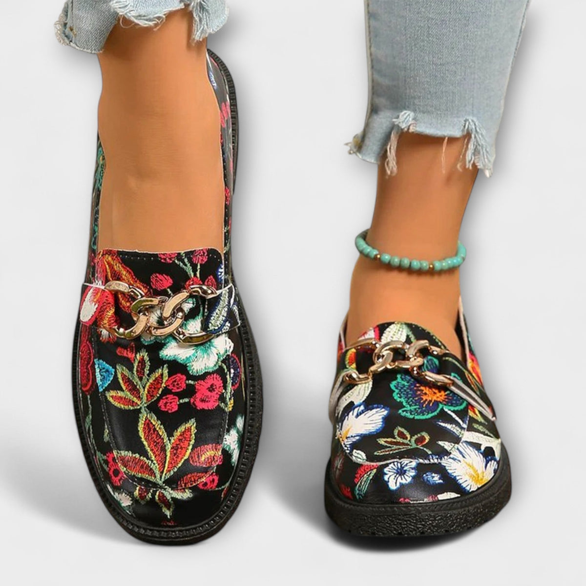 Camille floral loafers close-up showing gold chain trim across the front