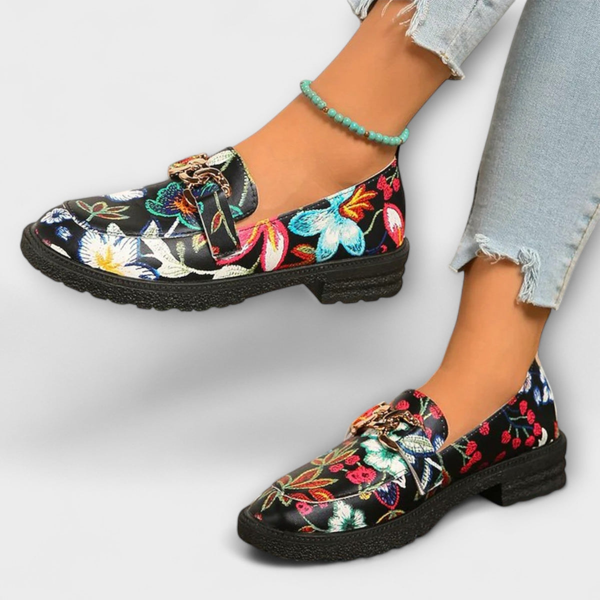 Camille floral loafers on model, angled view showing chunky black sole