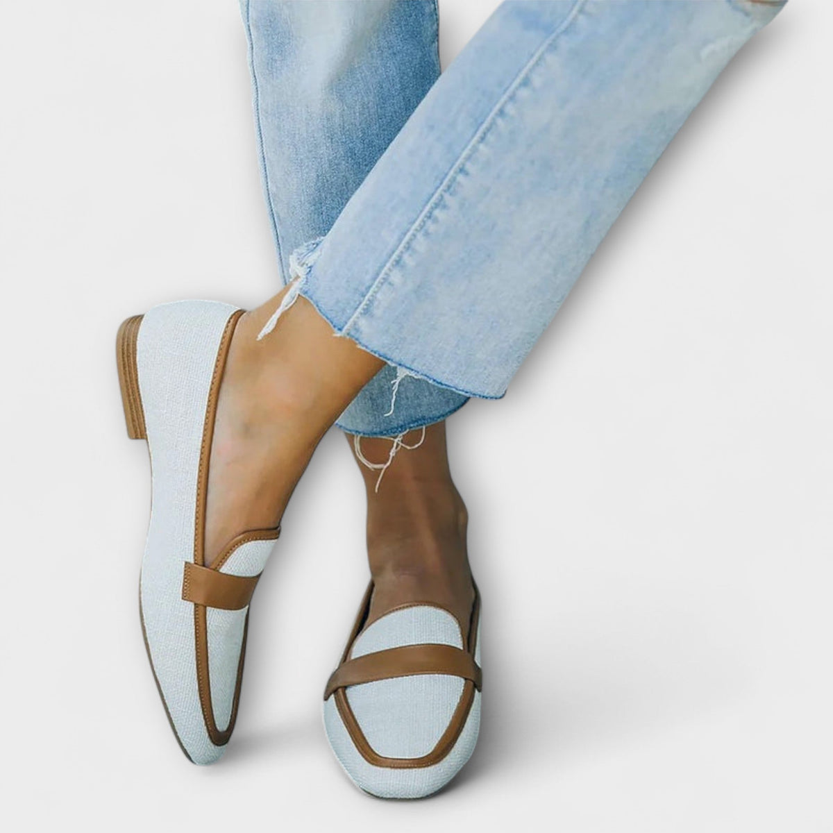 Bianca retro loafers in ice blue with tan strap, worn with cropped jeans