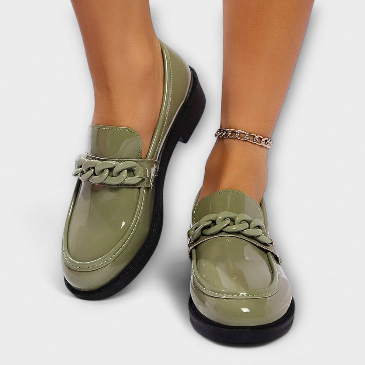 Delia chain loafers in green, worn front view