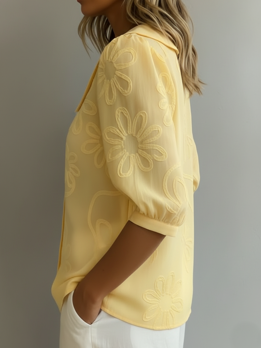 Aurélie floral blouse in yellow, side view showing textured daisy sleeve