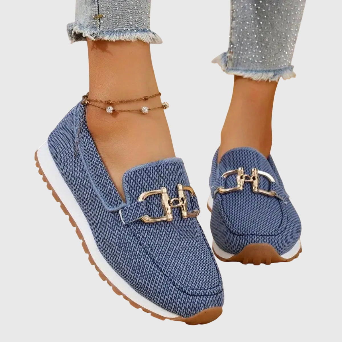 Winifred woven loafers in blue with gold buckle, worn front view