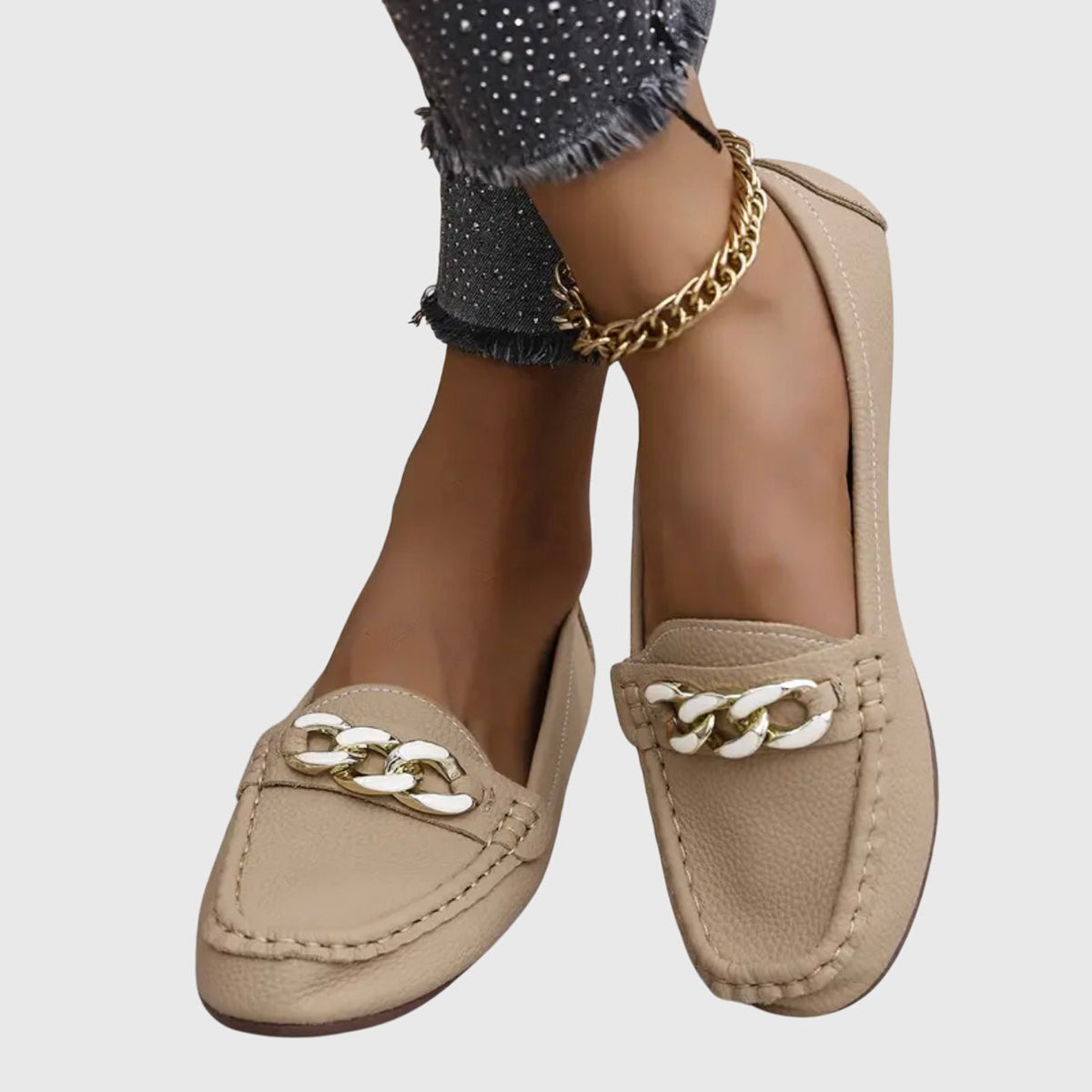 Madeleine chain-trim loafers in beige, worn front view