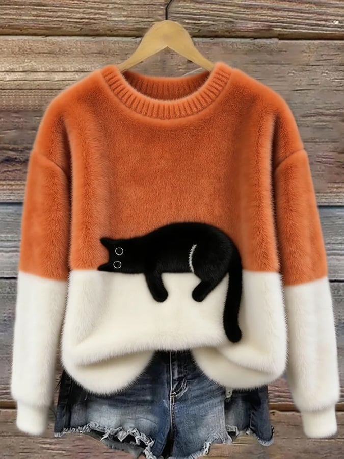Aileen cat print oversized sweater in orange and cream, front view