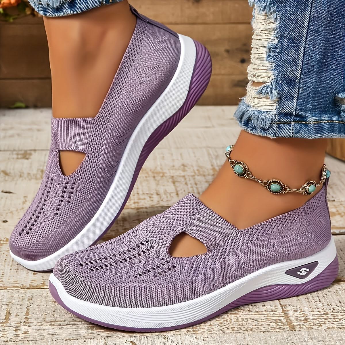Elara slip-on sneakers in light purple, worn angled view