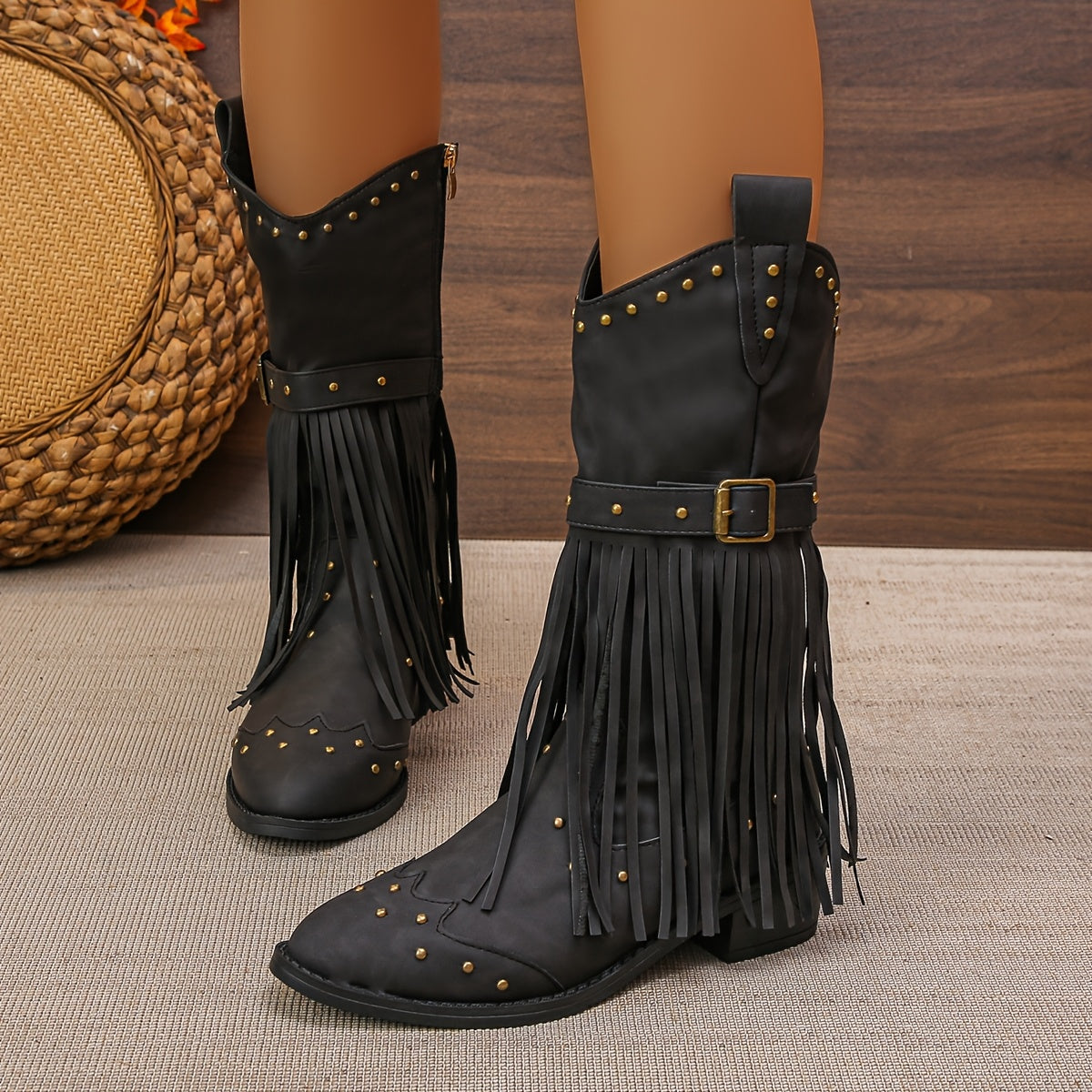 Aurelia western boots in black, angled view with buckled strap