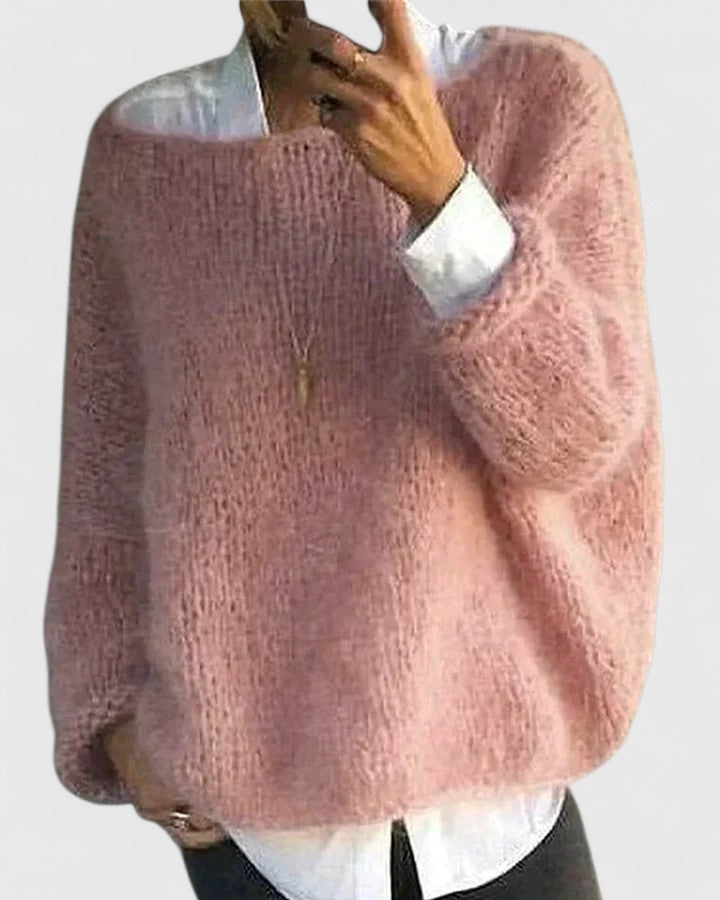 Jozelyn sweater in pink, worn over a white shirt, front view