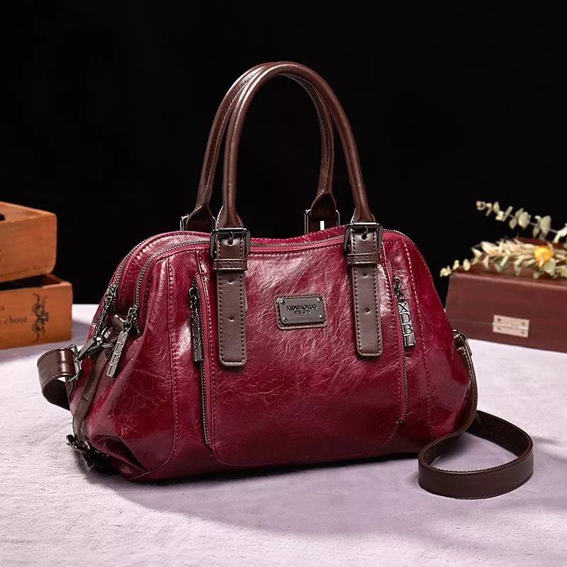 Eveline chic handbag in red, front view with shoulder strap