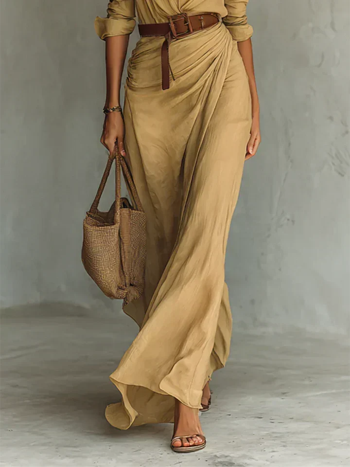 Una lapel-wrap maxi dress in khaki, close view of belt and wrap skirt
