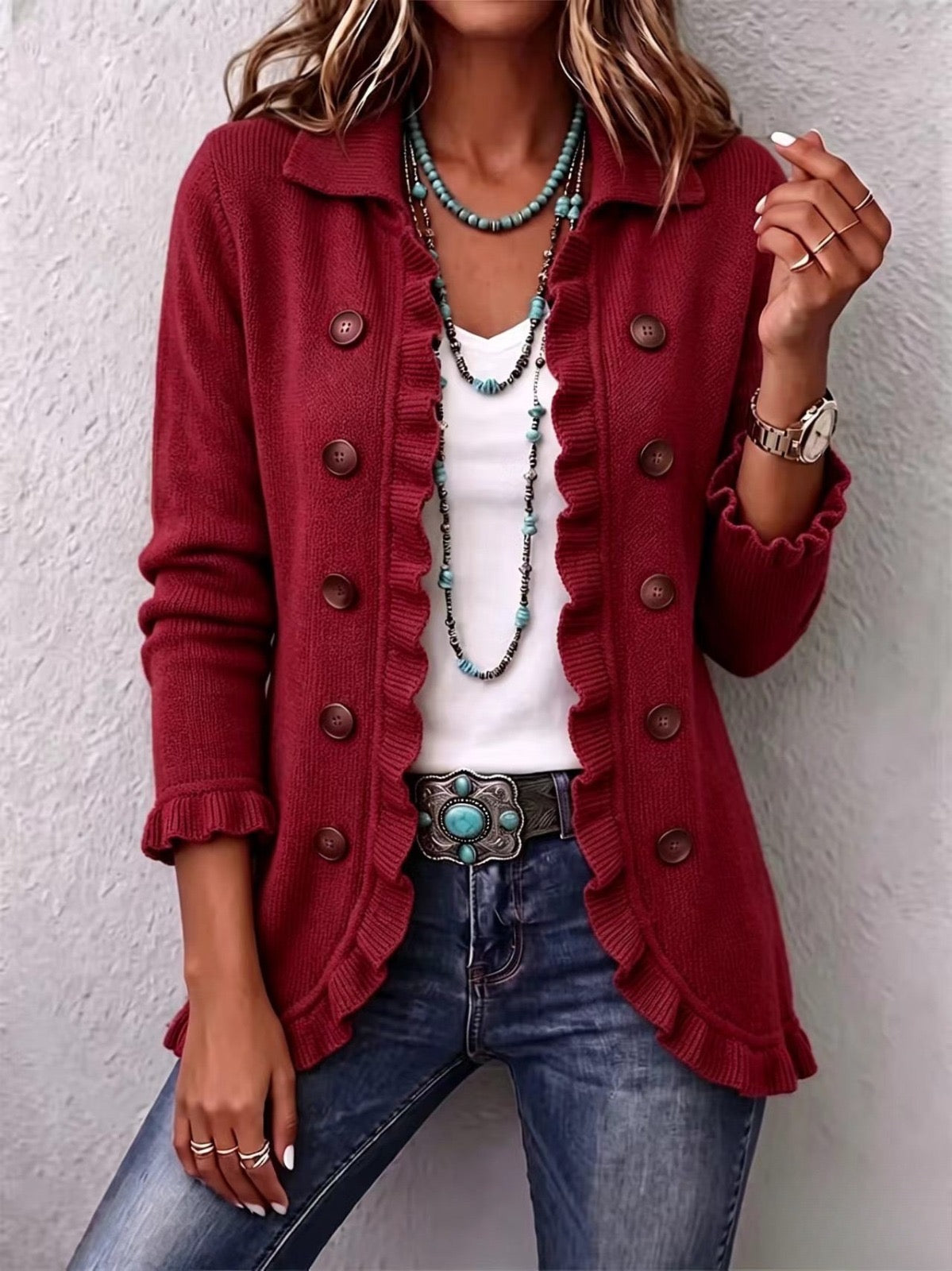 Rosalía ruby red knit ruffle jacket, front view worn with jeans